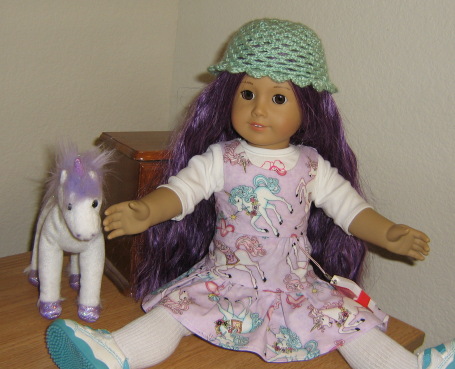 The new girl raises both hands part-way.
