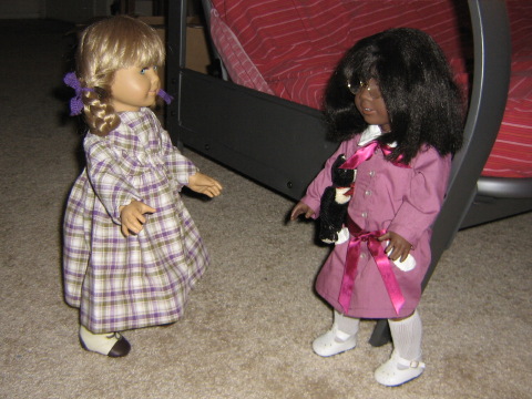 Kirsten comes up to May, wearing her plaid dress!